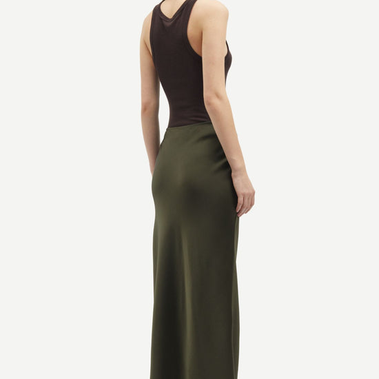 Side view of Saagneta Dark green long length skirt