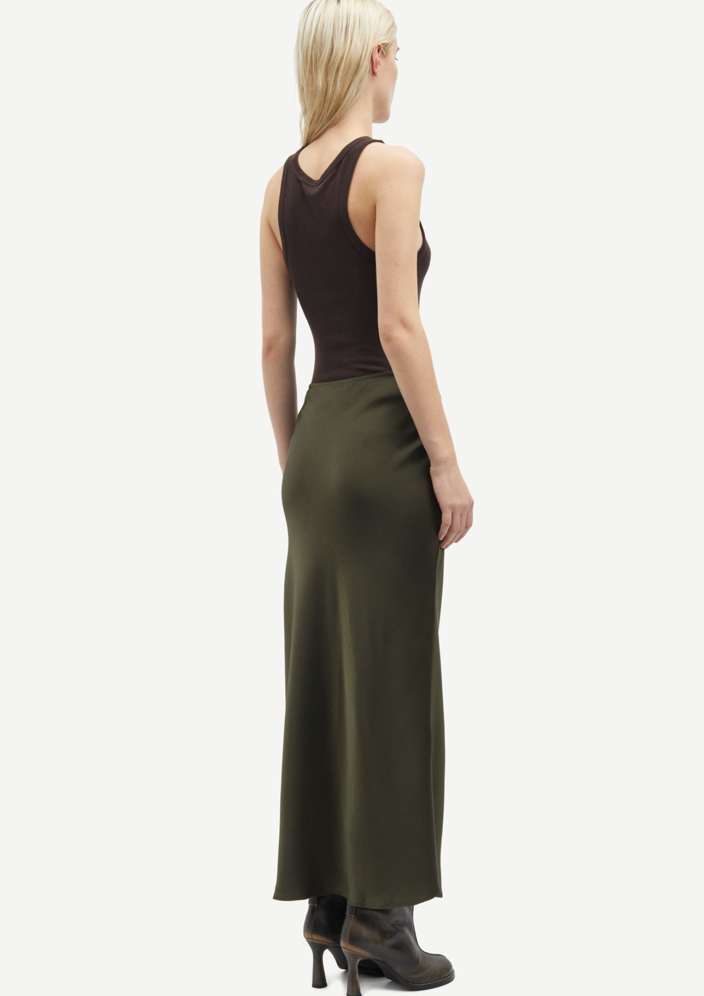 Side view of Saagneta Dark green long length skirt