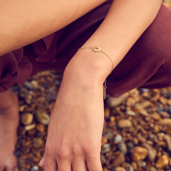 gold bracelet with sunshine in the centre and lobster clasp from rachel jackson  model shot