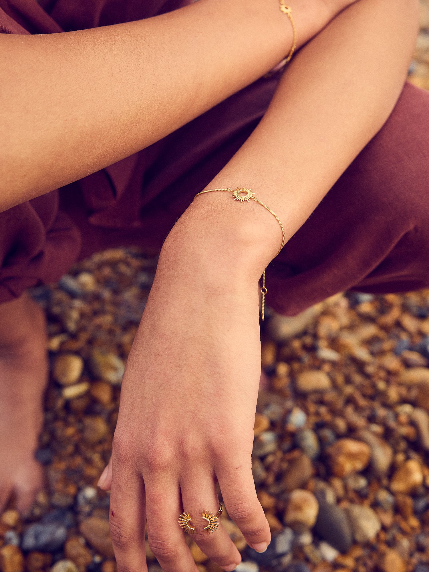 gold bracelet with sunshine in the centre and lobster clasp from rachel jackson  model shot