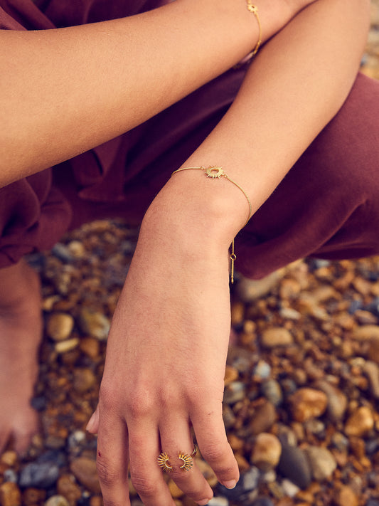 gold bracelet with sunshine in the centre and lobster clasp from rachel jackson  model shot