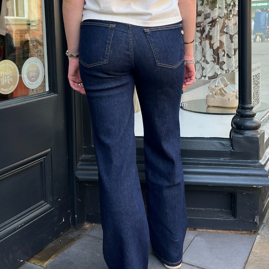 Dark navy jeans with a white top 