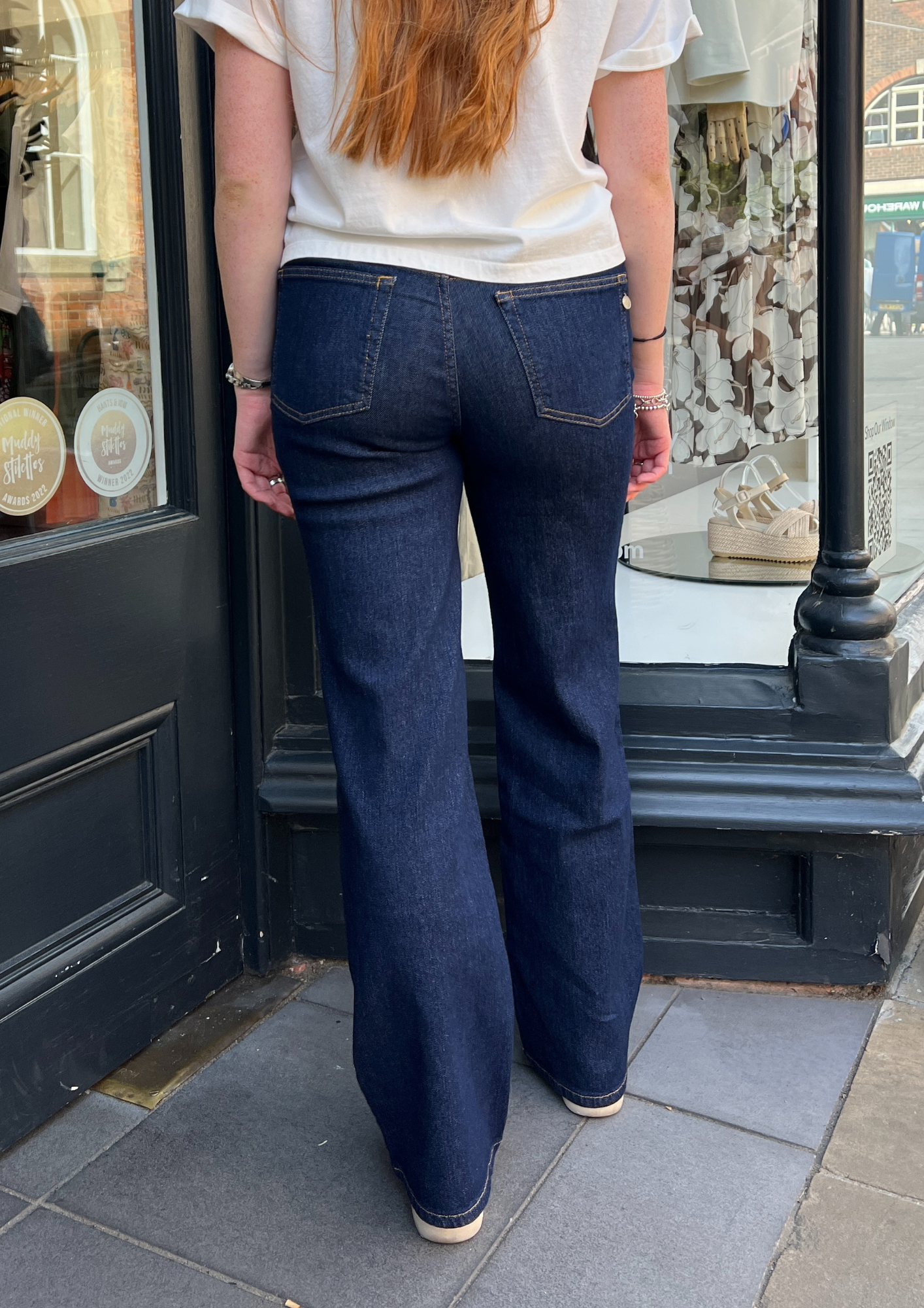 Dark navy jeans with a white top 