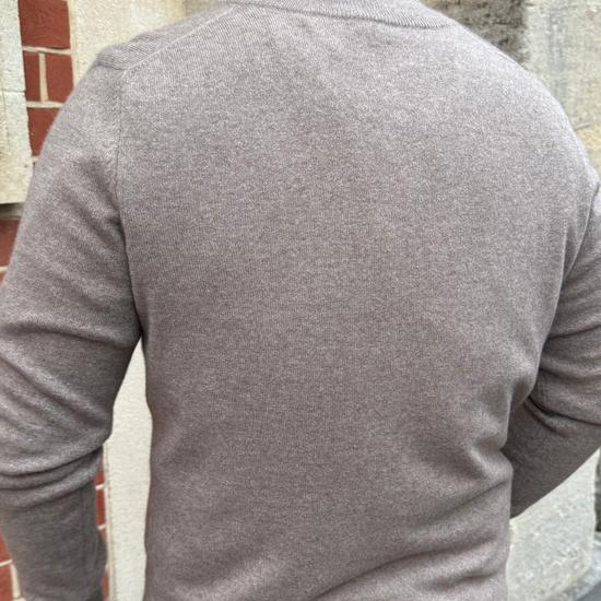 male model wearing brown cashmere quarter zip jumper.