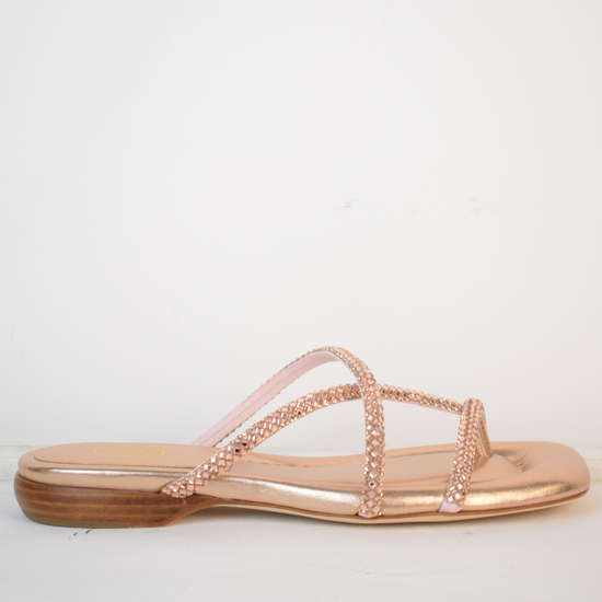 Slider style sandal in a rose gold colour with dominates on the top 