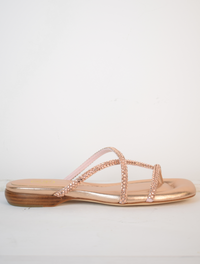 Slider style sandal in a rose gold colour with dominates on the top 