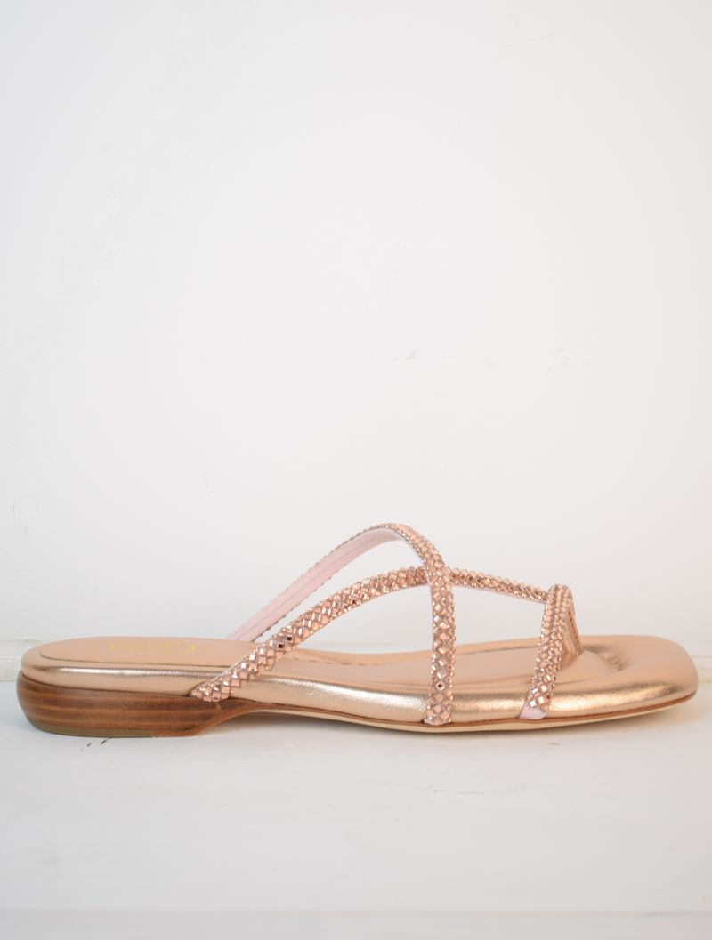 Slider style sandal in a rose gold colour with dominates on the top 
