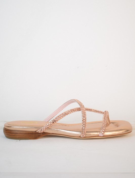 Slider style sandal in a rose gold colour with dominates on the top 