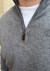 Male model wearing grey cashmere quarter zip jumper.