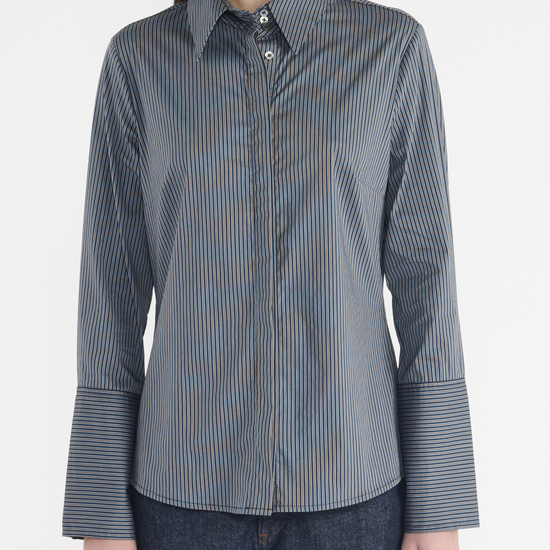 Classic shirt design with a collar, large cuff and concealed placket. Dark blue colours. 