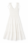 White tiered maxi dress with smocked bodice, ruffled V-neckline and shoulder ties in lightweight fabric.