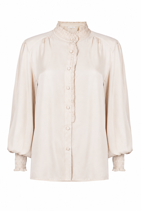 A cream-colored long-sleeve blouse with a high ruffled collar, button-down front, and textured ruffled cuffs, shown against a plain white background.