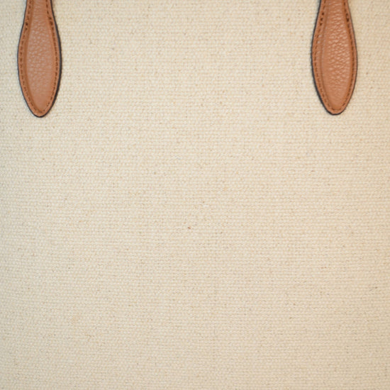 Neutral canvas totoe with tan leather trim