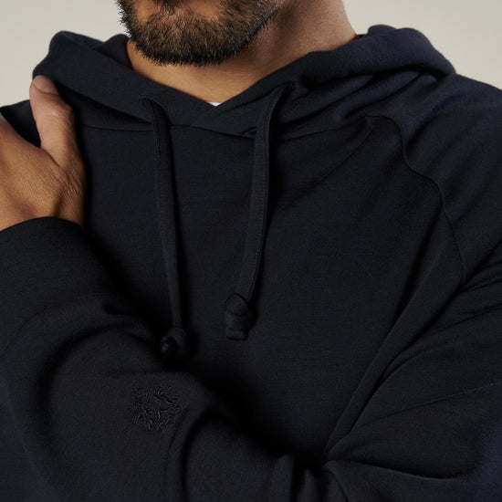 dark navy hooded sweatshirt with drawstring neck close up