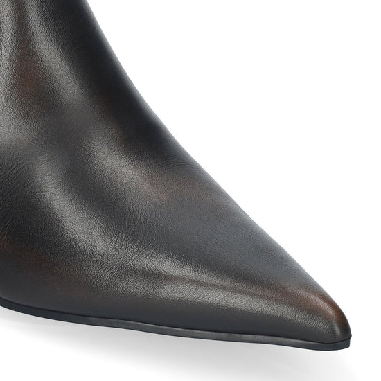 Close-up of a pointed-toe black leather boot on a clean white background.