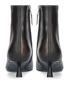 A pair of dark brown leather ankle boots with a pointed kitten heel, shown from the back on a white background.
