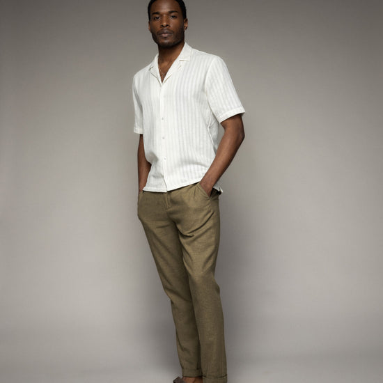 Cream shirt worn with khaki trouser on model