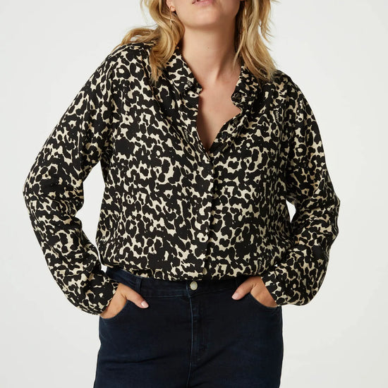 Classic shirt with full length covered placket in a black and ecru animal print