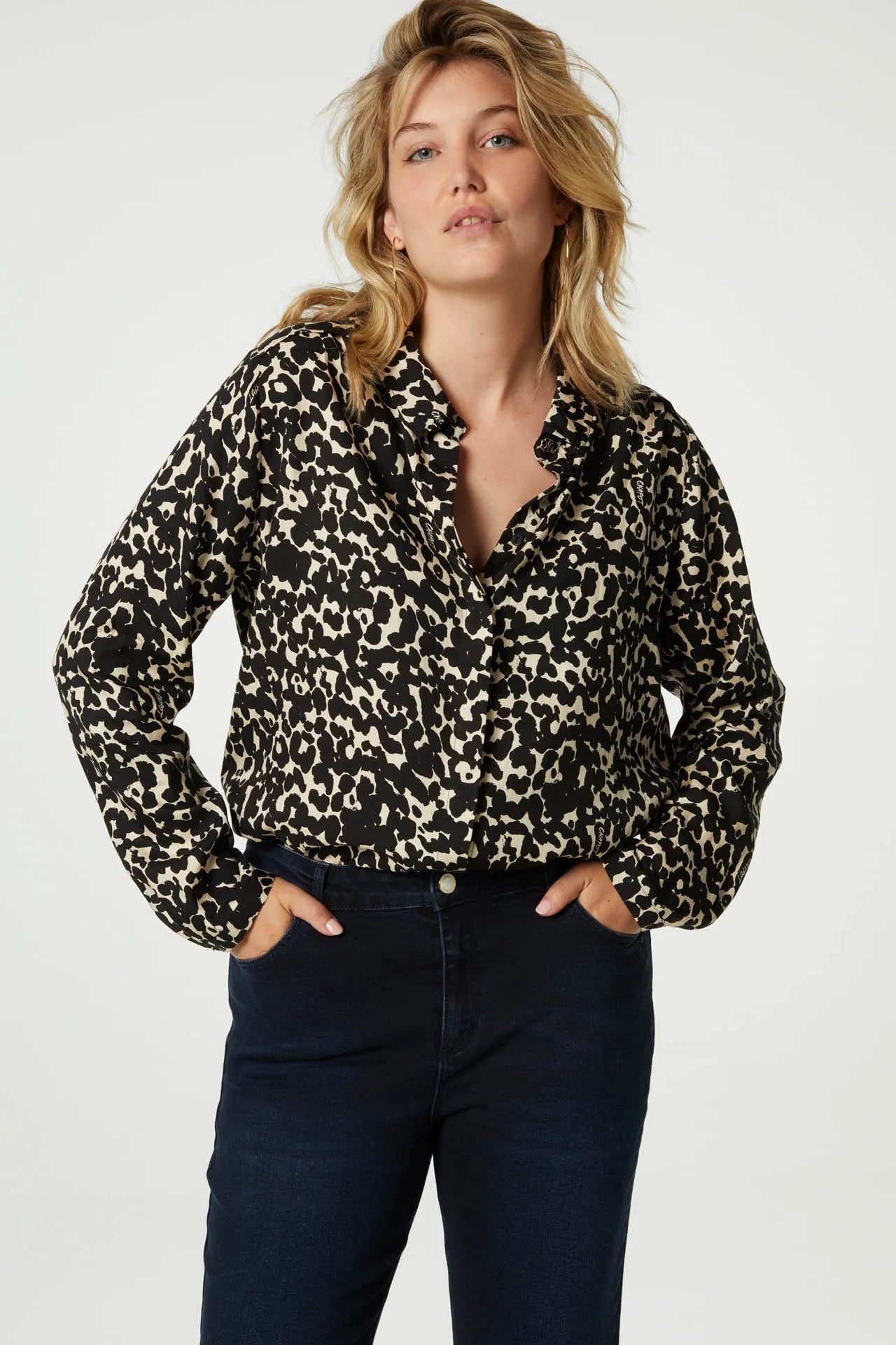 Classic shirt with full length covered placket in a black and ecru animal print