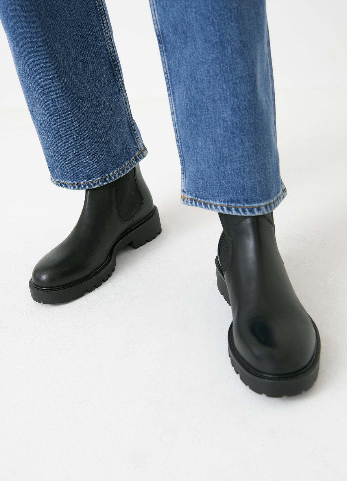 Black leather Chelsea boots with chunky rubber sole