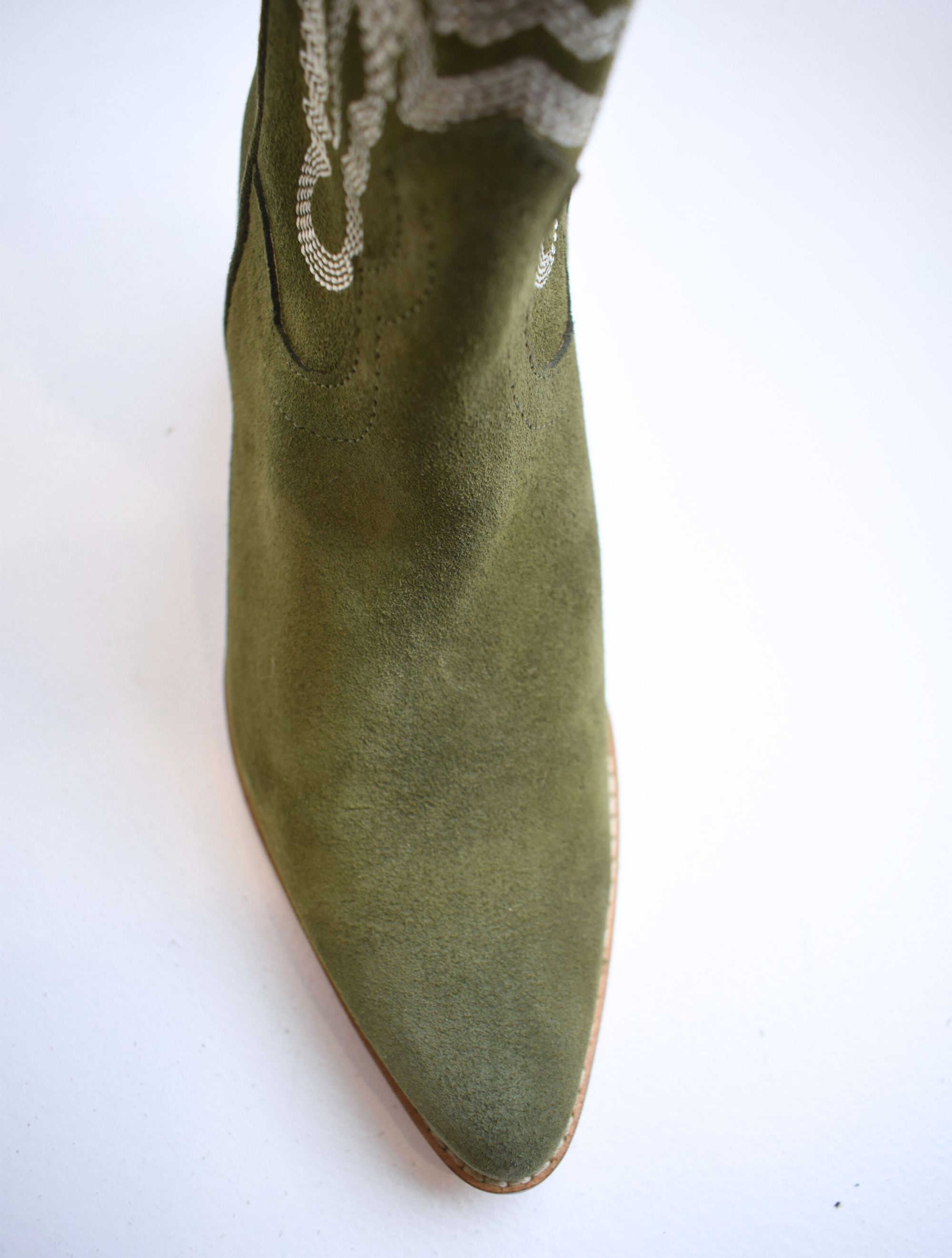 Army green cowboy boot with contrast stitching