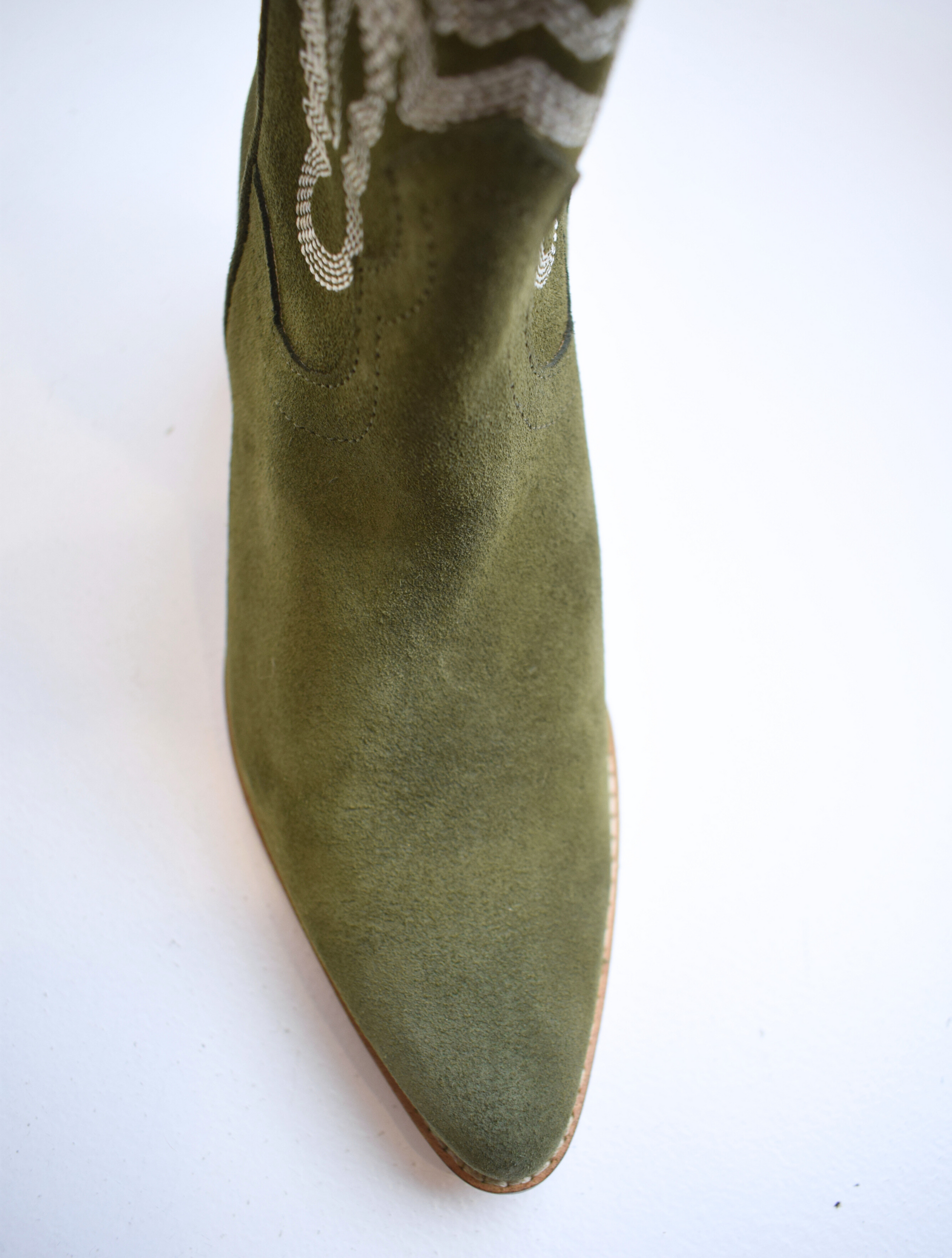 Army green cowboy boot with contrast stitching