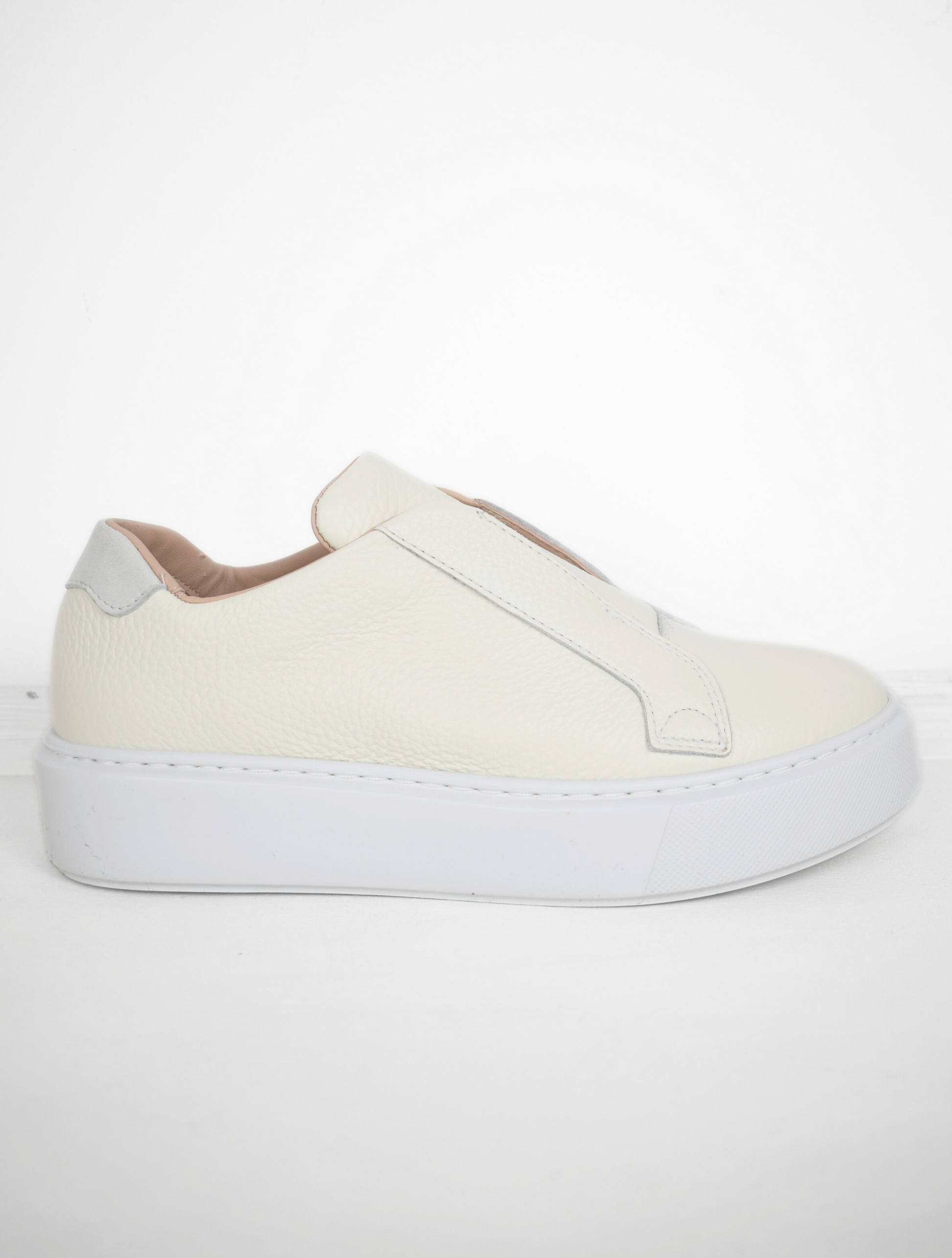 White platform trainers will elasticated side panels to make them easy to pull on