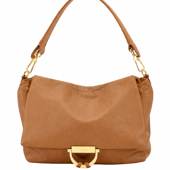Tan leather handbag with gold hardware on a white background