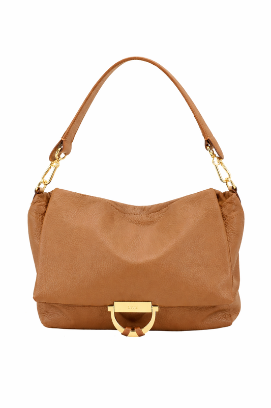 Tan leather handbag with gold hardware on a white background