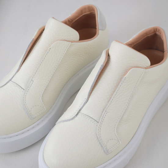 White platform trainers will elasticated side panels to make them easy to pull on