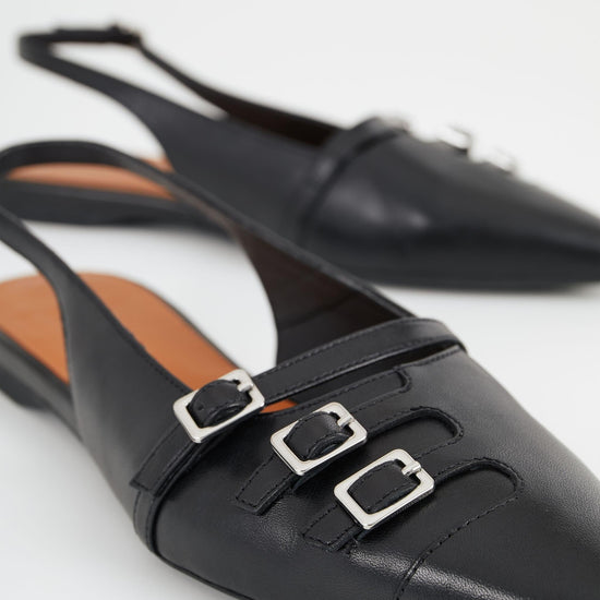 Black low slingbacks with silver buckle details