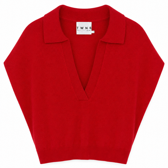 A bright red knit polo sweater with a V-neckline, laid flat against a solid white background.