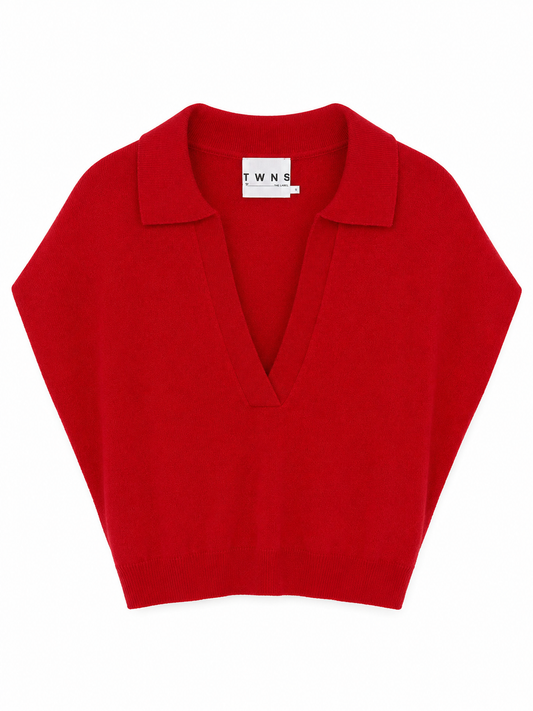 A bright red knit polo sweater with a V-neckline, laid flat against a solid white background.