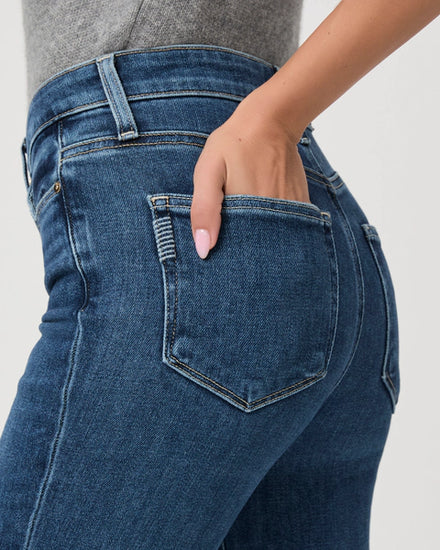 blue slim straight leg jeans with natural fading and slight ankle crop close up