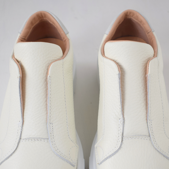 White platform trainers will elasticated side panels to make them easy to pull on