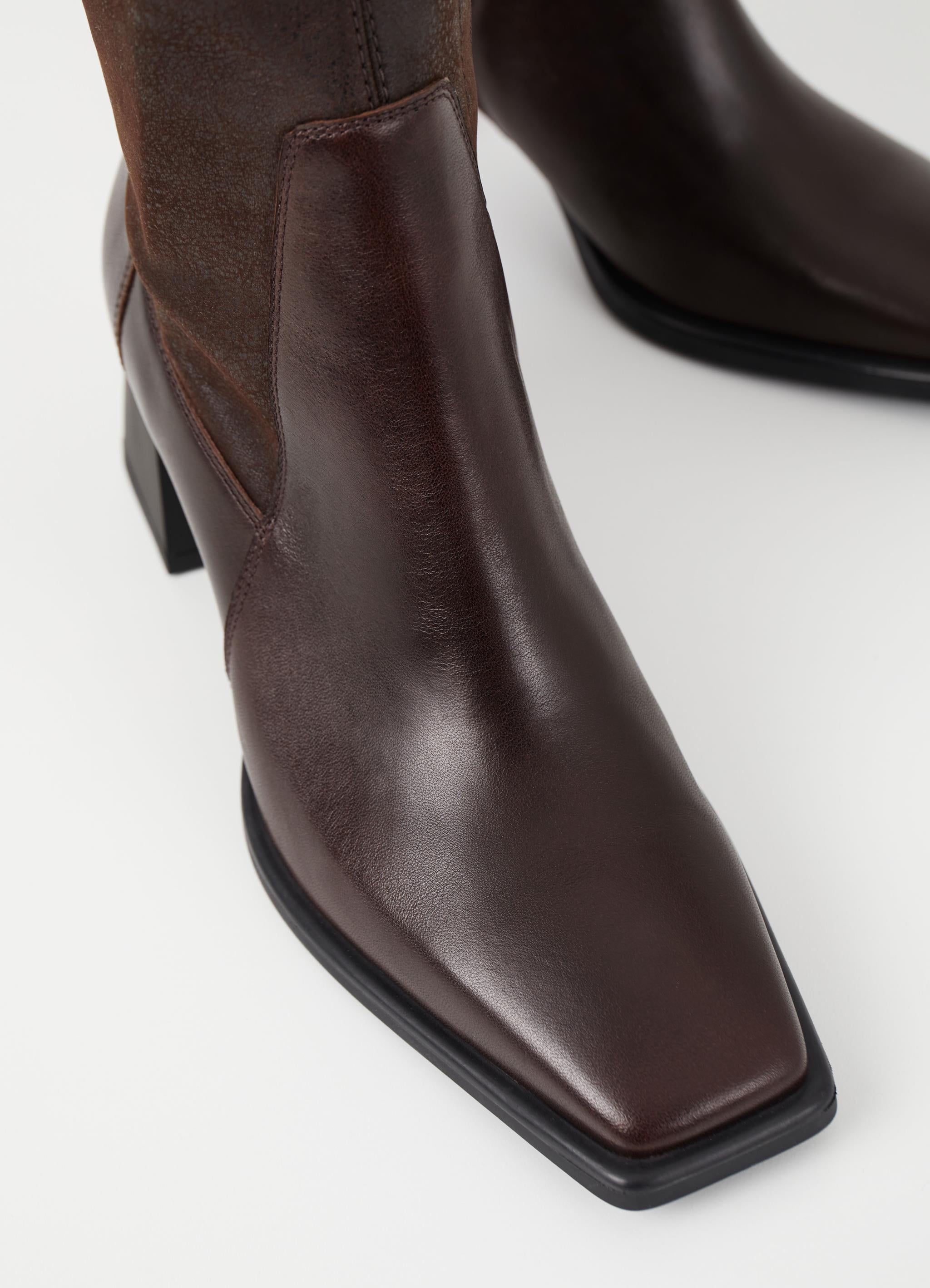 Mid-length inside zip brown leather boot with flared block rubber heel and rounded square toe