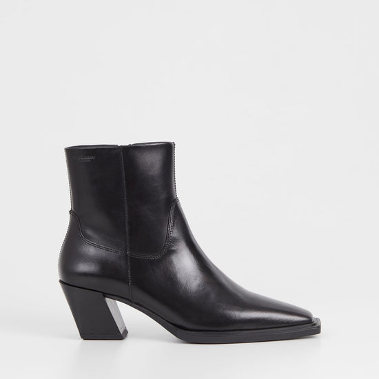 Western inspired slanted block heel black leather ankle boot