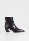 Western inspired slanted block heel black leather ankle boot