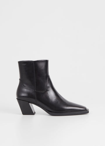 Western inspired slanted block heel black leather ankle boot