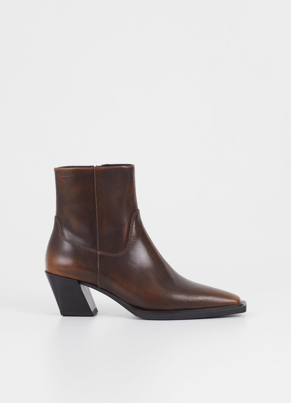 Dark brown western inspired boot with slanted stacked block heel and inside zip fastening 