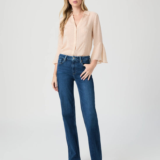 Blue jeans worn with cream blouse from Paige