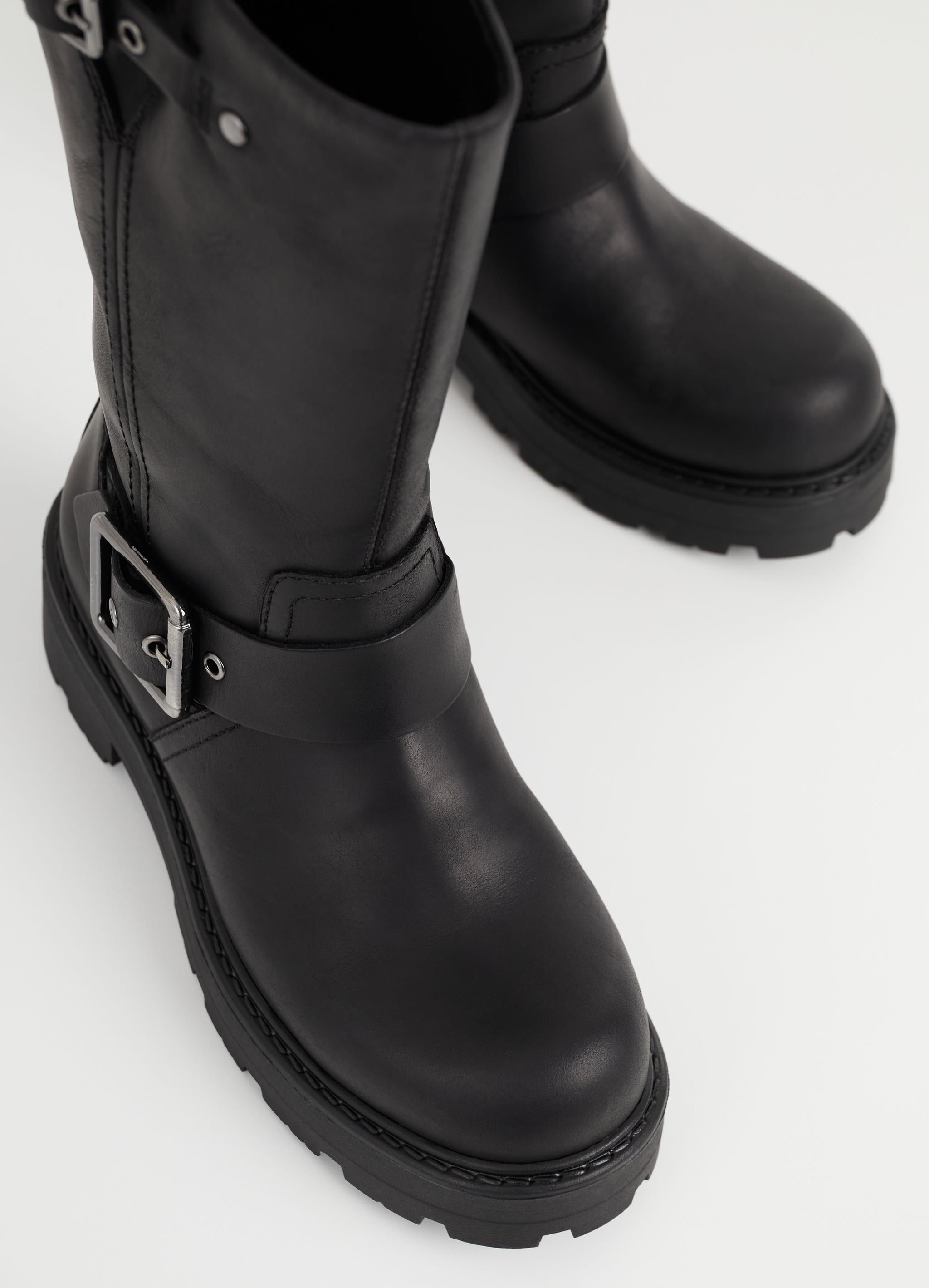 Ugg black hot sale buckle boots