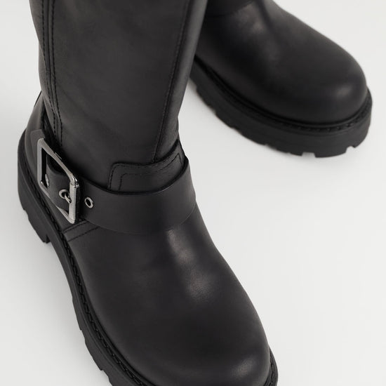 Leather black biker boot with chunky sole and heel and buckle details