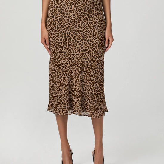 Person wearing a leopard print skirt from Paige