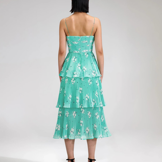 Aqua midi dress with spaghetti straps and pleated triple tiered skirt with small cut out in the bodice