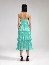 Aqua midi dress with spaghetti straps and pleated triple tiered skirt with small cut out in the bodice