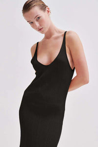 Black long loose knit dress with sewn in wave design and narrow straps and V neckline