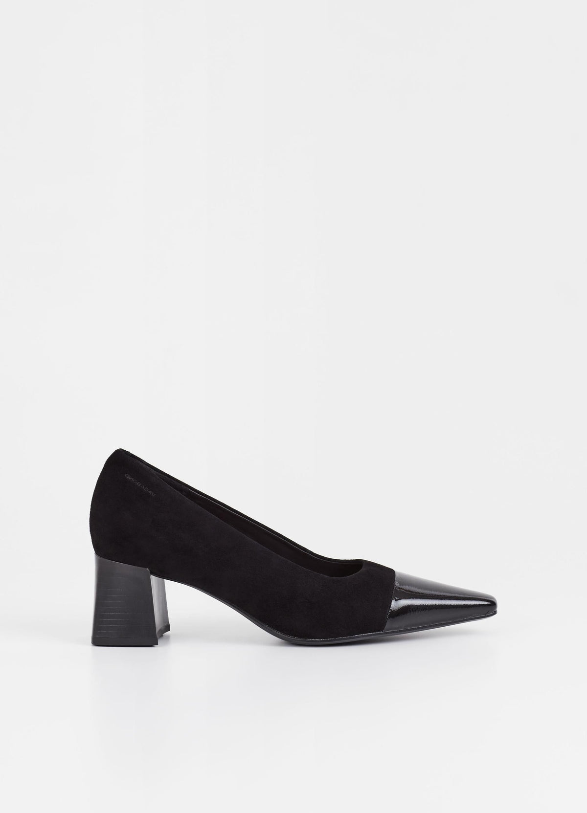 Black suede pumps with stacked black heel and pointed contrast black patent toe