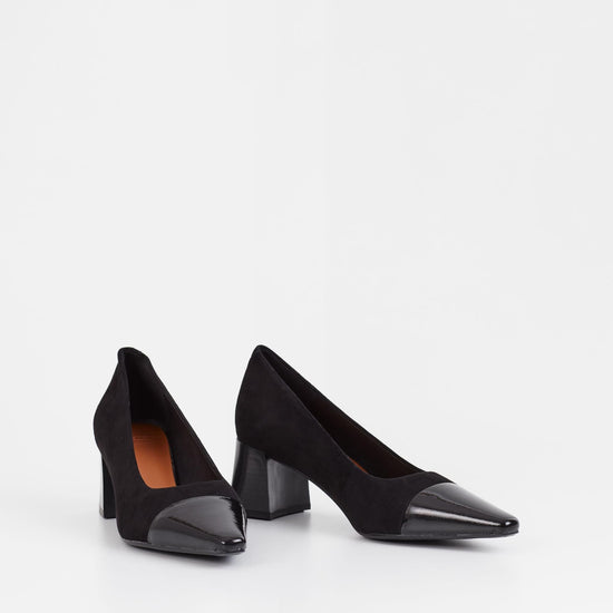 Black suede pumps with stacked black heel and pointed contrast black patent toe