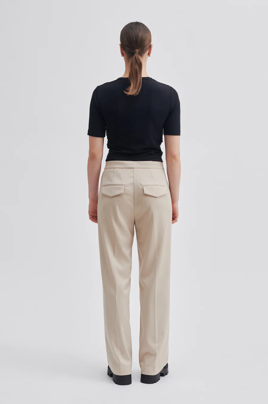 Beige straight leg trousers with flat front and zip fastening